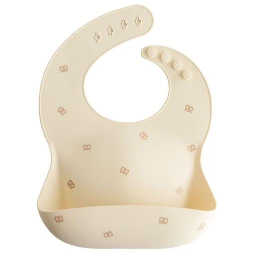 Mushie - Bavoir à poche en silicone Pretzel