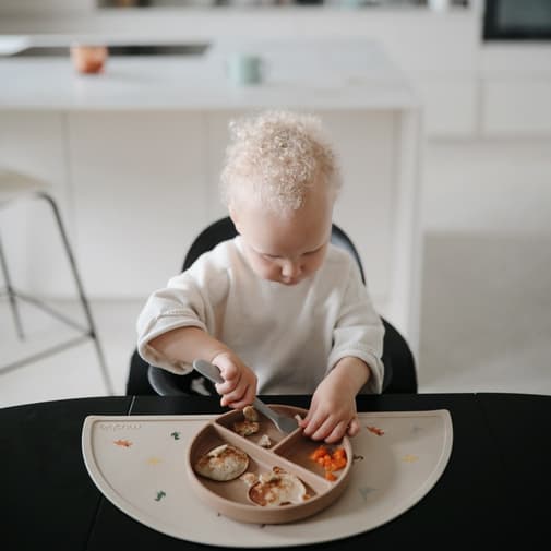 Mushie - Set de table en silicone Dinosaure