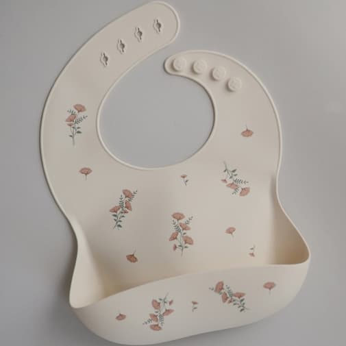 Mushie - Bavoir à poche en silicone Pink Flowers