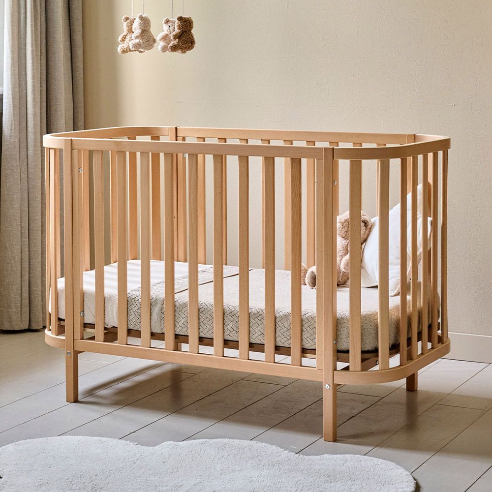 Petite Amélie | Lit bébé ovale Cocoon | Bois naturel | 60x120 cm | Design réglable sur 3 hauteurs pour un sommeil confortable et sécurisé (Petite Amélie) - Image 1