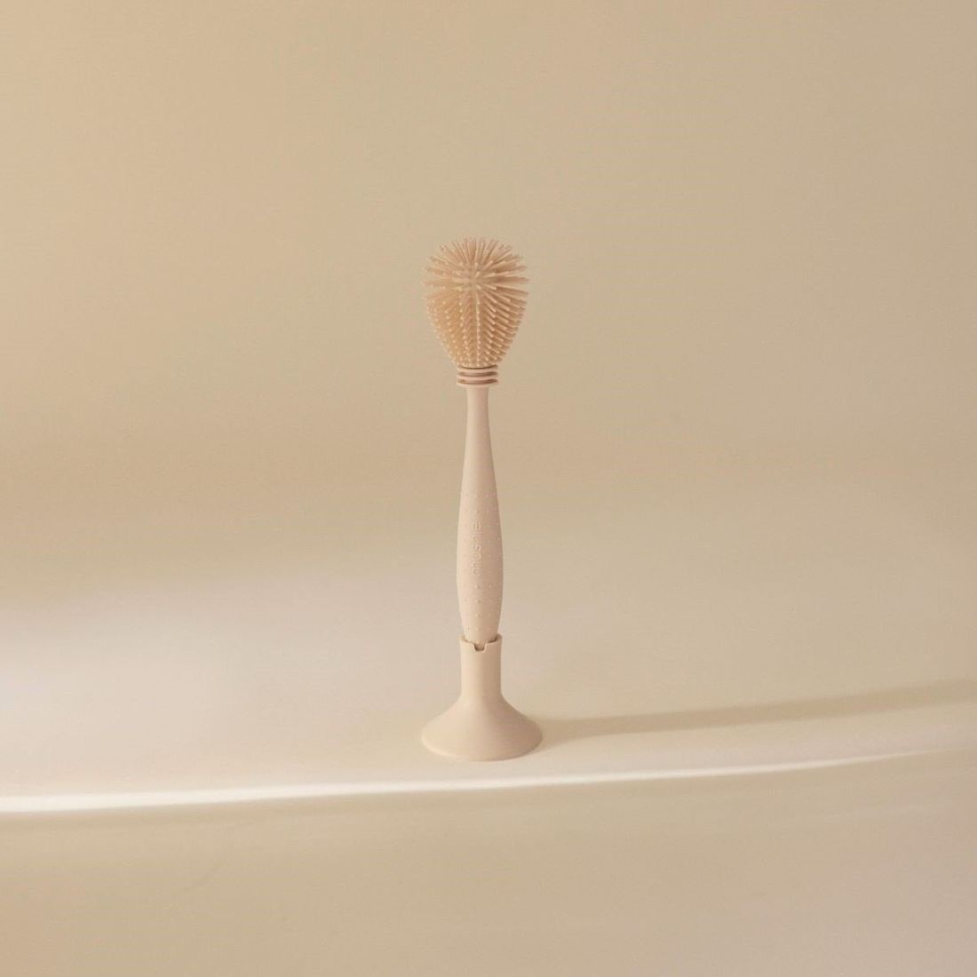 Goupillon en silicone Shifting Sand (Mushie) - Couverture