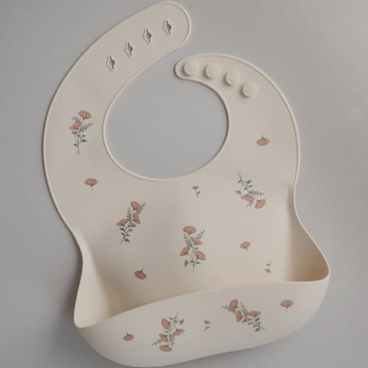 Bavoir à poche en silicone Pink Flowers (Mushie) - Couverture